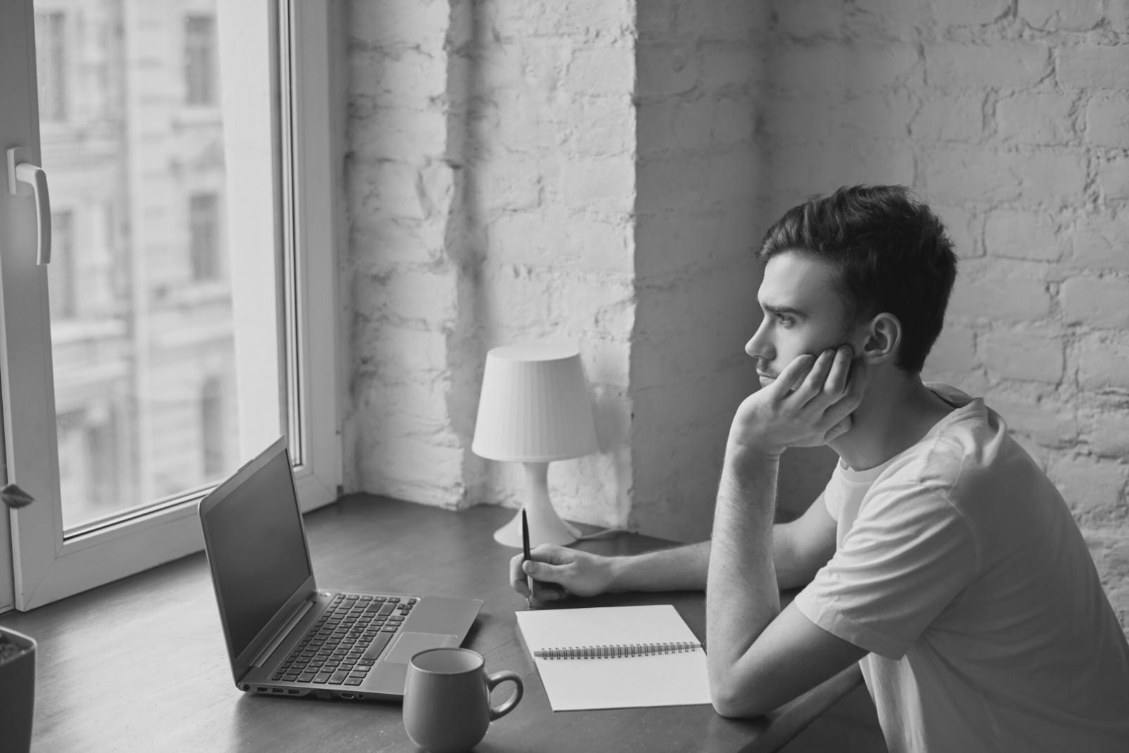 Financial analyst reviewing historical business data and creating realistic budget projections